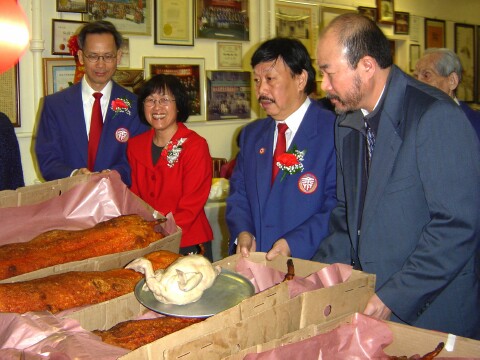 Ceremonial Golden Pigling donor Chairman Jim Yee and Betty