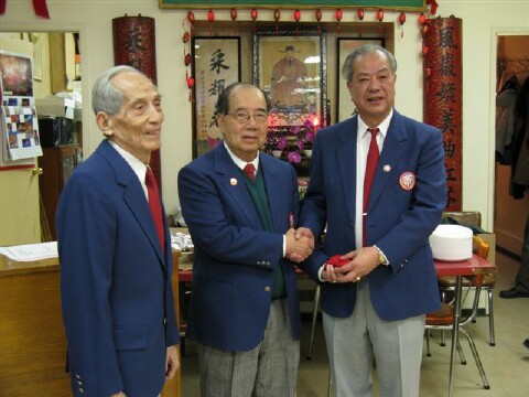 Chairman Kan
                Yu accepting YFT Seal from Advisor Dick Yee