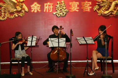 Grand sons and daughter playing music to celebrate the event