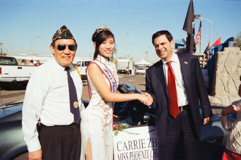 Pictured with Phoenix Mayor Phil Gordon and
                      Phoenix Chinese Queen, Carrie Zhao is Phoenix YFT
                      members Edward Yue (left of Queen).