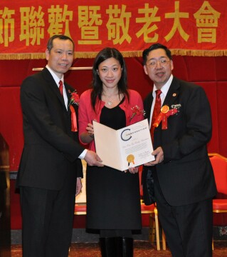 Ms. Ung presenting Commendation from NYC
                Comptroller Thompson