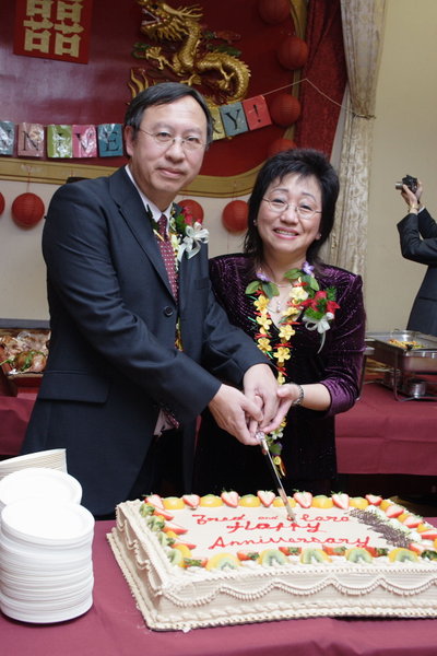 image of Fred and
                Clara cutting cake